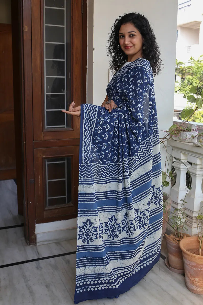The mulmul saree is one of the most versatile and elegant pieces that you can wear. The Indigo Muse cotton saree is a great option for daily wear as it looks classy and gives you an effortless style statement.