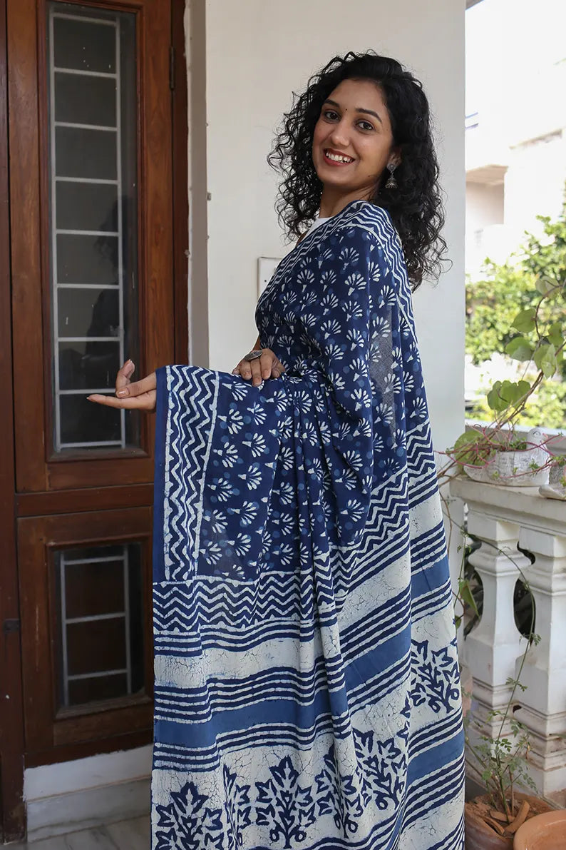 The mulmul saree is one of the most versatile and elegant pieces that you can wear. The Indigo Muse cotton saree is a great option for daily wear as it looks classy and gives you an effortless style statement. 