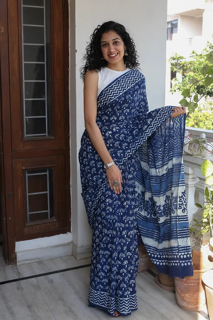 The mulmul saree is one of the most versatile and elegant pieces that you can wear. The Indigo Muse cotton saree is a great option for daily wear as it looks classy and gives you an effortless style statement. 