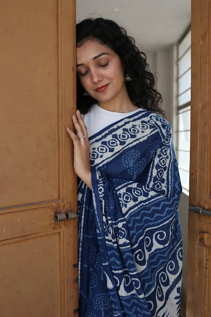 The Indigo Bouquet cotton saree is a great option for daily wear as it looks classy and gives you an effortless style statement.