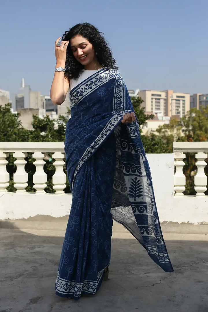 The Indigo Bouquet cotton saree is a great option for daily wear as it looks classy and gives you an effortless style statement.