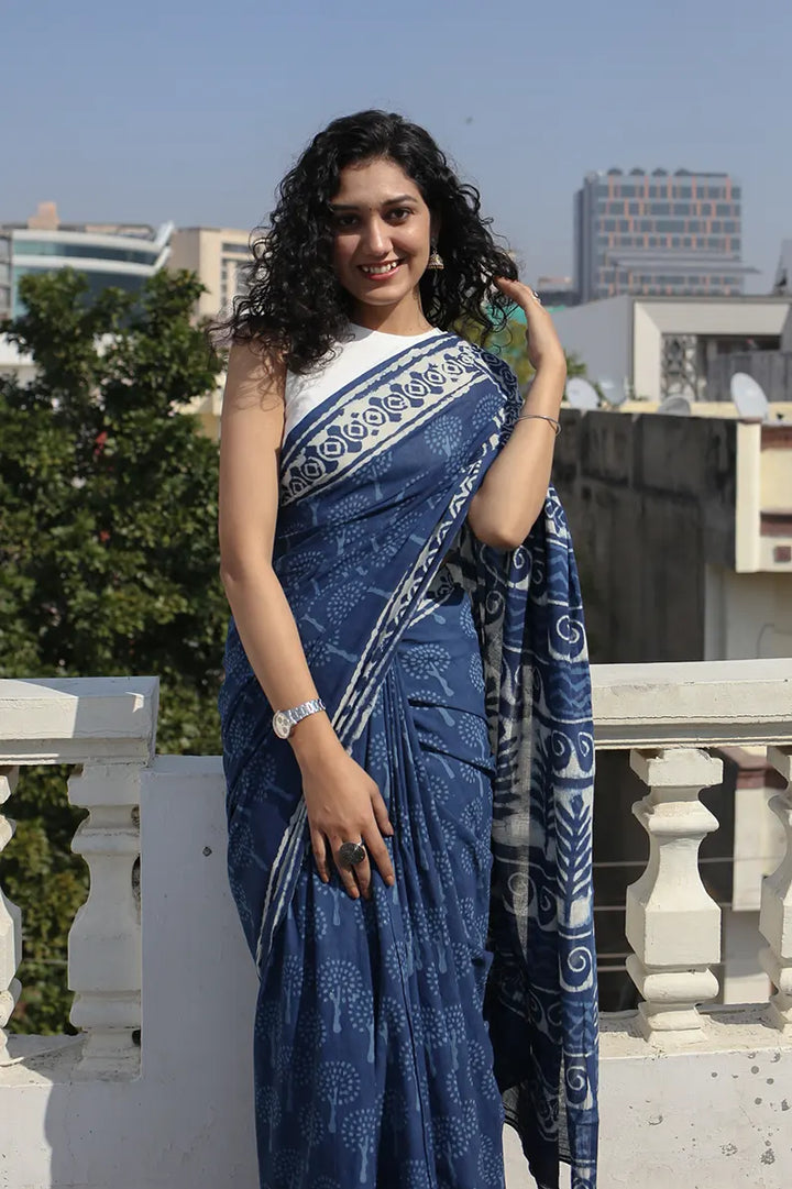 The Indigo Bouquet cotton saree is a great option for daily wear as it looks classy and gives you an effortless style statement.