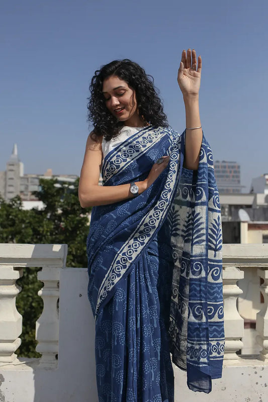 The Indigo Bouquet cotton saree is a great option for daily wear as it looks classy and gives you an effortless style statement.